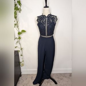 Sugarlips Navy lace jumpsuit. Size XS. NWT.
